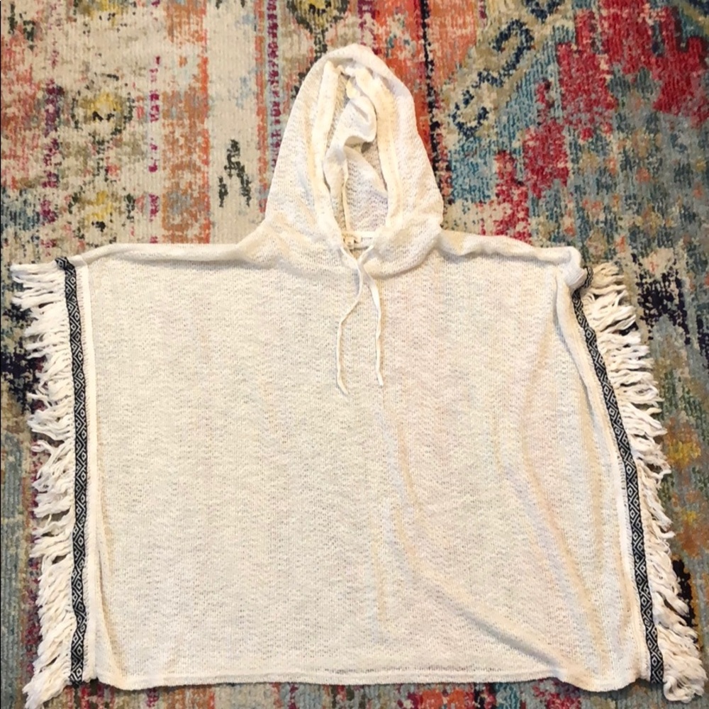 Cream Poncho with black and white chevron design.
